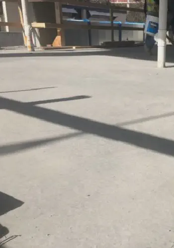 Economical material to raise the elevation of a concrete slab